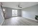 Open-concept living room with gray floors, stairs, large window that fills the space with natural light at 128 Evergreen Trl # 4, Cartersville, GA 30121