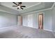 This main bedroom features three doors and modern gray paint at 128 Evergreen Trl # 4, Cartersville, GA 30121