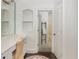 Bright bathroom with vanity and entrance to another room at 165 Ansley Way, Roswell, GA 30075