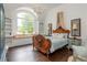 Bedroom features large arched window with built-in bench and bookshelf at 165 Ansley Way, Roswell, GA 30075