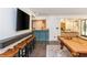 Entertaining game room with a wet bar, pool table, tv and stylish decor at 165 Ansley Way, Roswell, GA 30075