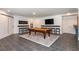 Entertaining game room with a pool table, wet bar, tv and stylish decor at 165 Ansley Way, Roswell, GA 30075