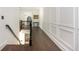 Second story hallway with hardwood floors and decorative wall molding at 165 Ansley Way, Roswell, GA 30075