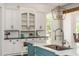 Stylish kitchen with custom cabinetry, marble countertops, and a large island for entertaining at 165 Ansley Way, Roswell, GA 30075