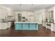 Gourmet kitchen featuring a blue island, stainless steel appliances, and custom white cabinetry at 165 Ansley Way, Roswell, GA 30075