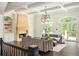 Bright and inviting living room featuring coffered ceilings, fireplace, and large french doors at 165 Ansley Way, Roswell, GA 30075