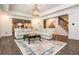 Spacious living room with coffered ceiling, slate flooring, and cozy seating area at 165 Ansley Way, Roswell, GA 30075