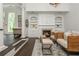 Bright living room with a fireplace and built-in shelves at 165 Ansley Way, Roswell, GA 30075