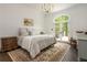 Spacious main bedroom with hardwood floors, large windows, and access to a balcony at 165 Ansley Way, Roswell, GA 30075