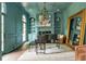 Elegant music room featuring custom built-ins, a fireplace, wainscoting, and a grand piano at 165 Ansley Way, Roswell, GA 30075