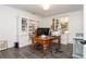 Well-lit office space with custom built-ins, a large window, and classic wooden desk at 165 Ansley Way, Roswell, GA 30075
