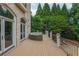 Spacious open deck with wrought-iron railing, offering outdoor seating and wooded views at 165 Ansley Way, Roswell, GA 30075