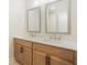 Bright bathroom features a double sink vanity with sleek faucets, modern mirrors, and ample counter space at 2545 Bertrand Way, Cumming, GA 30041