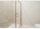 Modern bathroom featuring a glass shower door, tiled walls, and a clean, minimalist design at 2545 Bertrand Way, Cumming, GA 30041