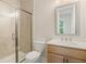 Bathroom features a glass-enclosed shower and modern vanity with white countertop at 2545 Bertrand Way, Cumming, GA 30041