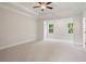 Spacious bedroom with tray ceiling and carpet flooring, perfect for relaxation at 2545 Bertrand Way, Cumming, GA 30041