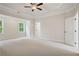 Spacious bedroom with tray ceiling and carpet flooring, waiting for personalization at 2545 Bertrand Way, Cumming, GA 30041
