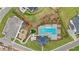 Aerial view of the community pool with playground and ample parking spaces at 2545 Bertrand Way, Cumming, GA 30041