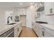 Spacious kitchen with stone countertops, stainless appliances, and ample cabinet space at 2545 Bertrand Way, Cumming, GA 30041