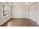 Bright living room with large windows, hardwood floors and tray ceiling at 2545 Bertrand Way, Cumming, GA 30041