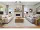 Living room features a fireplace, neutral decor and hardwood floors at 2545 Bertrand Way, Cumming, GA 30041