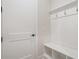 Convenient mudroom with built-in bench, storage hooks, and a stylish door at 2545 Bertrand Way, Cumming, GA 30041