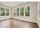 Bright room featuring natural light from large windows and beautiful wood floors at 2545 Bertrand Way, Cumming, GA 30041