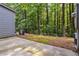 Concrete patio beside a wooded area at 3335 Thornbridge Dr, Powder Springs, GA 30127