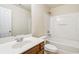 Well-lit bathroom with a single vanity, tub-shower combination, and essential fixtures for a comfortable experience at 3335 Thornbridge Dr, Powder Springs, GA 30127