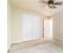Spacious bedroom featuring a ceiling fan, carpeted floors, and double closets, creating a comfortable and organized space at 3335 Thornbridge Dr, Powder Springs, GA 30127