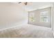 Spacious primary bedroom with neutral carpet and a ceiling fan at 3335 Thornbridge Dr, Powder Springs, GA 30127