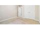 Comfortable bedroom featuring carpeted floors, neutral walls, and closet space, creating a relaxing and functional area at 3335 Thornbridge Dr, Powder Springs, GA 30127