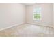 Bright bedroom with natural light, neutral walls, and carpeted floors, providing a serene and inviting atmosphere at 3335 Thornbridge Dr, Powder Springs, GA 30127