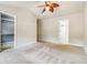 Primary bedroom with ceiling fan and access to en suite bathroom and closet at 3335 Thornbridge Dr, Powder Springs, GA 30127