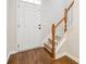 Foyer with hardwood floors, staircase, and a white front door, providing a bright entryway at 3335 Thornbridge Dr, Powder Springs, GA 30127