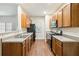 Well-lit kitchen features stainless steel appliances and plenty of cabinets at 3335 Thornbridge Dr, Powder Springs, GA 30127