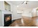 Living room featuring a cozy fireplace, hardwood floors, and an open layout for entertaining at 3335 Thornbridge Dr, Powder Springs, GA 30127