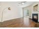 Spacious living room with hardwood floors, fireplace, and sliding glass doors providing ample light at 3335 Thornbridge Dr, Powder Springs, GA 30127