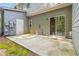 Back patio with view of sliding glass doors, an exterior door, and green space at 3335 Thornbridge Dr, Powder Springs, GA 30127