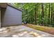 Concrete patio sits adjacent to a wooded area at 3335 Thornbridge Dr, Powder Springs, GA 30127