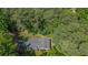 Aerial view of the house nestled in a lush, mature treed lot at 5632 Stillwater Ct, Stone Mountain, GA 30087