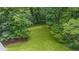 Large backyard with lush green grass and ample space for outdoor activities at 5632 Stillwater Ct, Stone Mountain, GA 30087