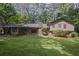 Lush backyard with mature trees, offering a serene and private outdoor retreat at 5632 Stillwater Ct, Stone Mountain, GA 30087