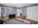 This light-filled bedroom offers hardwood floors, soothing gray walls and access to an ensuite bath at 5632 Stillwater Ct, Stone Mountain, GA 30087