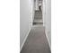 Hallway features carpet flooring and stairs leading up to the second level of the home at 5632 Stillwater Ct, Stone Mountain, GA 30087