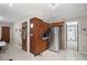 View of the kitchen that has wooden cabinets, modern appliances, white countertops and backsplash, and a stainless steel refrigerator at 5632 Stillwater Ct, Stone Mountain, GA 30087