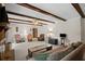 Bright living room featuring exposed wood beams, fireplace, and comfortable seating at 5632 Stillwater Ct, Stone Mountain, GA 30087