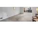 Neutral living room with space for dining and lots of natural light at 5632 Stillwater Ct, Stone Mountain, GA 30087