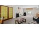 Spacious living room with double doors and a seating area by the windows, and a TV stand at 5632 Stillwater Ct, Stone Mountain, GA 30087