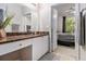 Bathroom featuring marble counters, white cabinets, and a view into the bedroom at 10 Perimeter Summit Ne Blvd # 4223, Brookhaven, GA 30319